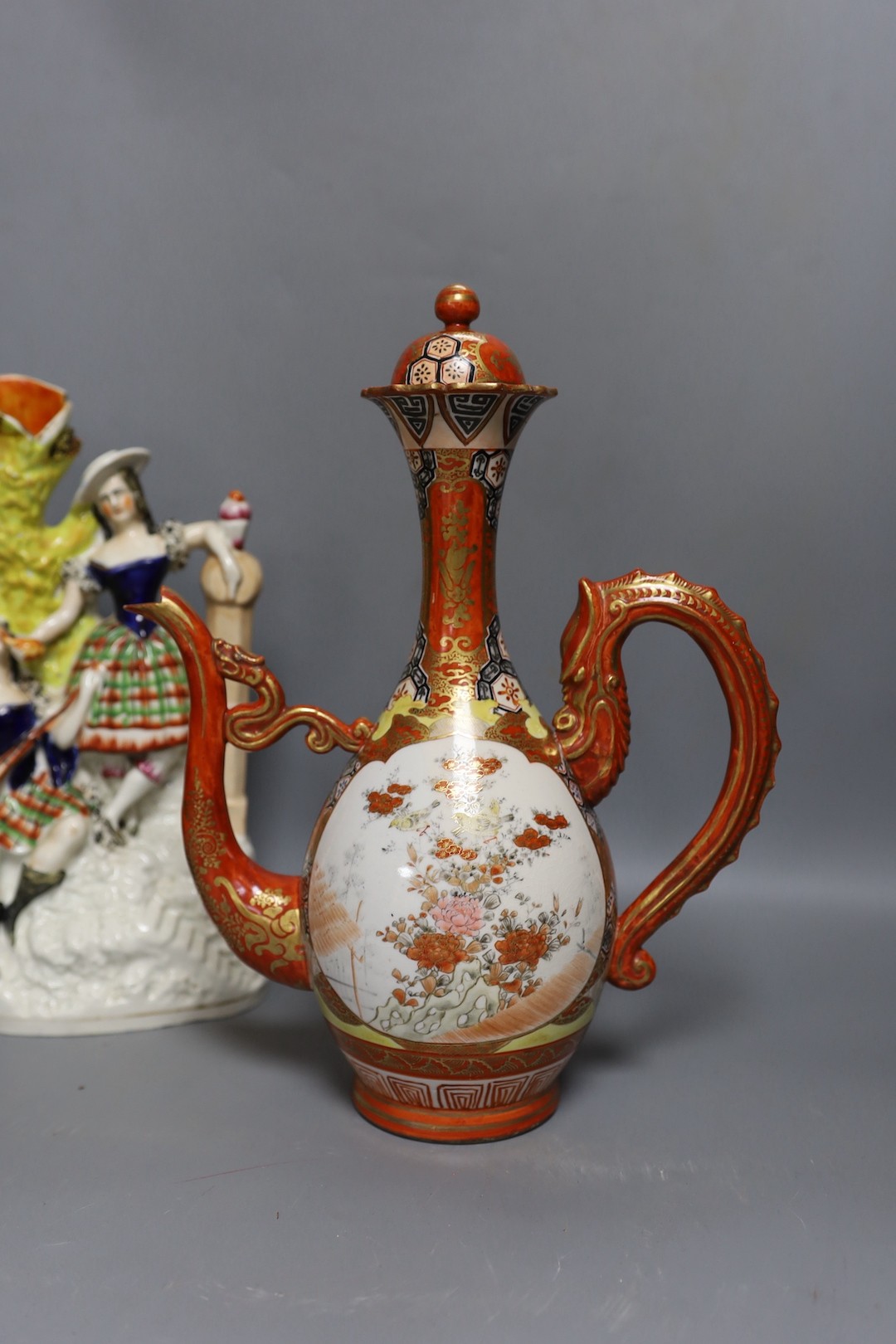 A Victorian Staffordshire flatback group, a pair of Staffordshire figures, an inkwell and a Japanese kutani coffee pot 32cm